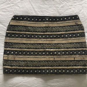 Mini skirt with gold and silver beads and studs